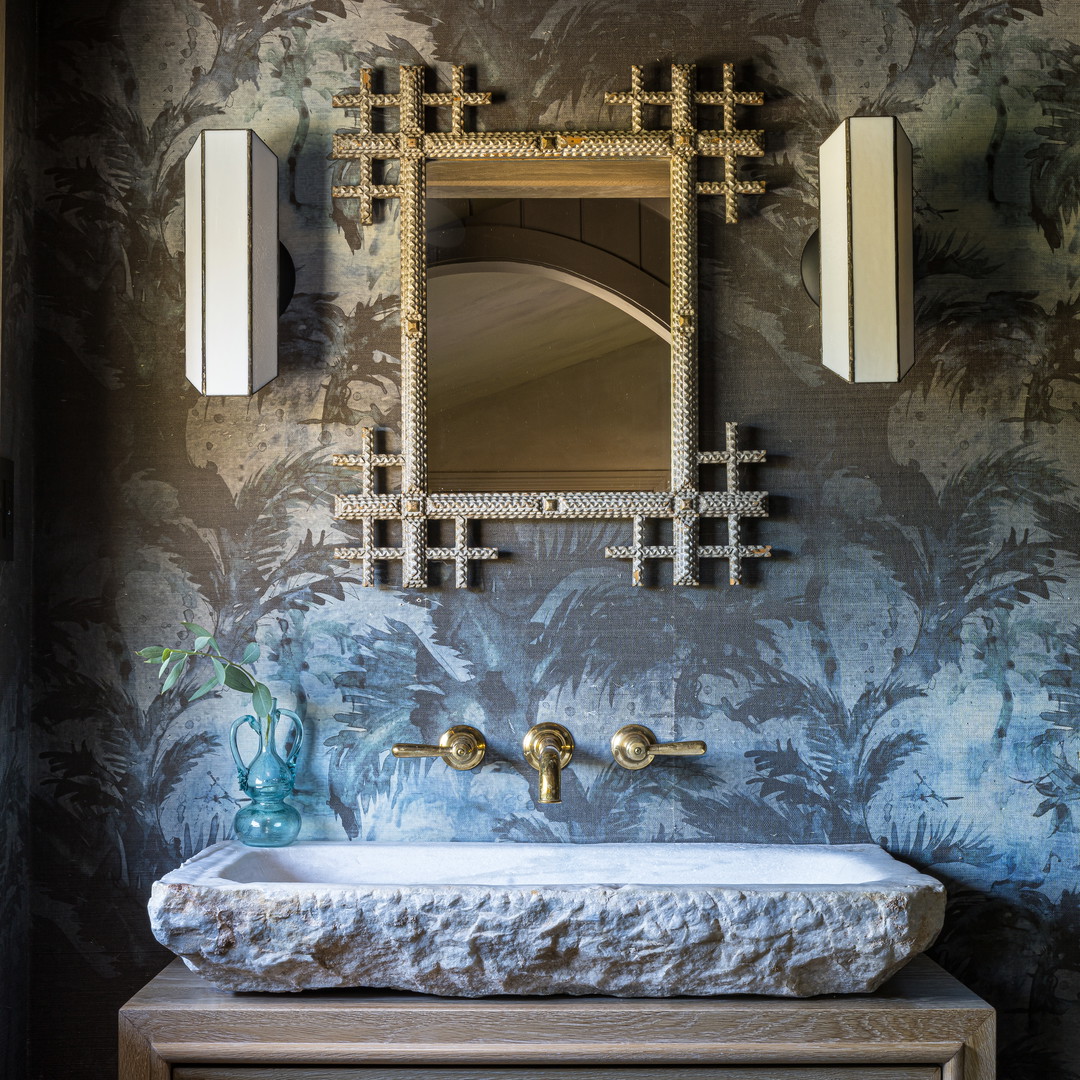 a bathroom sink with a mirror above it