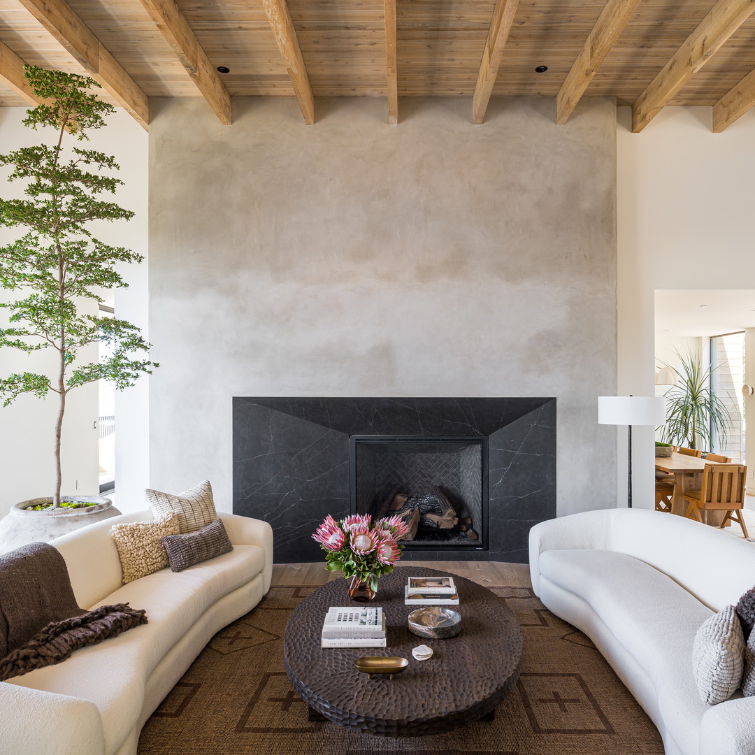 a living room filled with furniture and a fire place