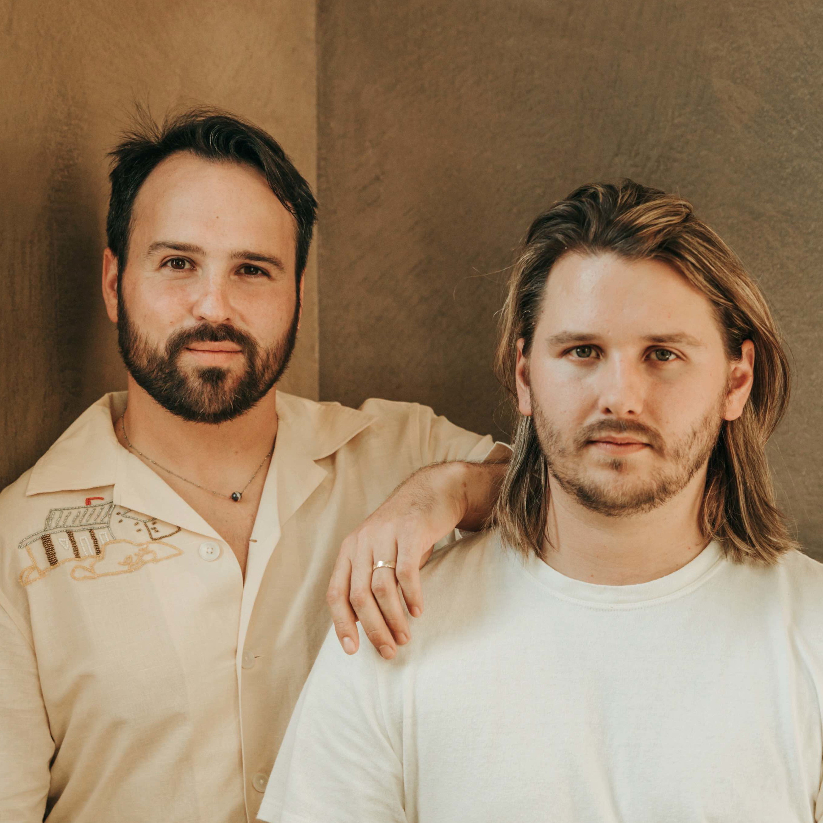 a couple of men standing next to each other