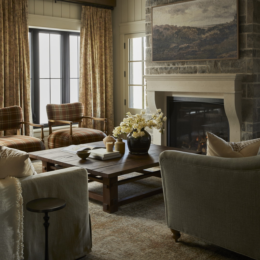 a living room filled with furniture and a fire place