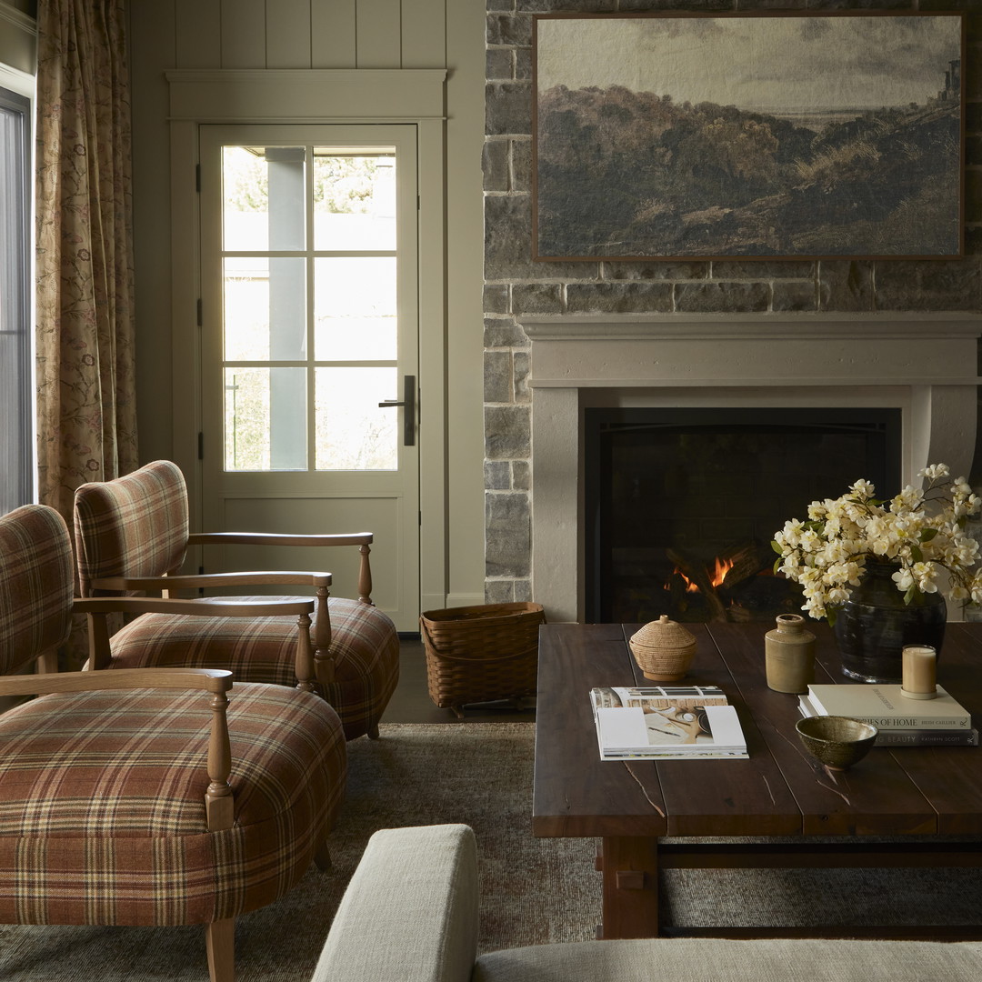 a living room filled with furniture and a fire place