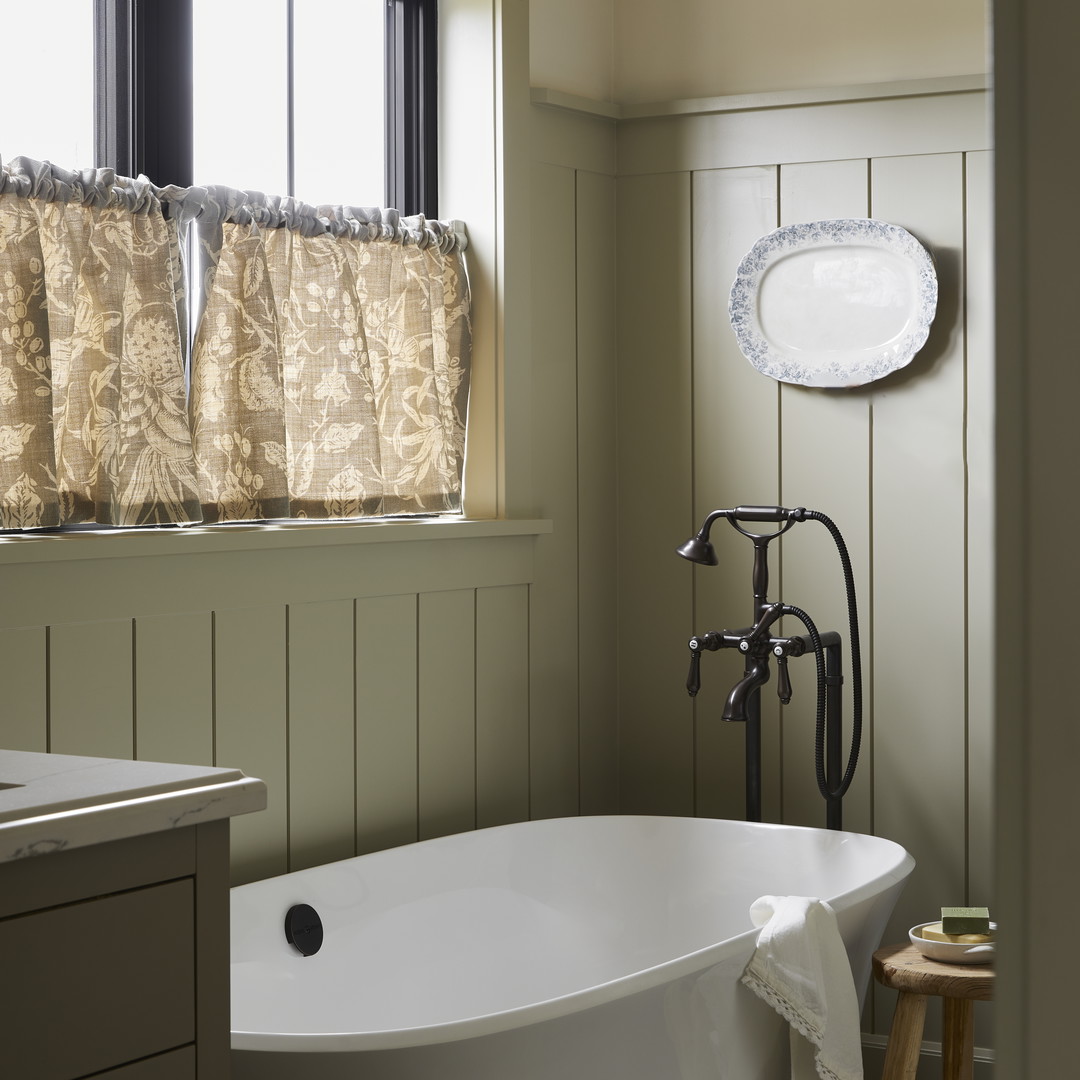 a white bath tub sitting next to a window