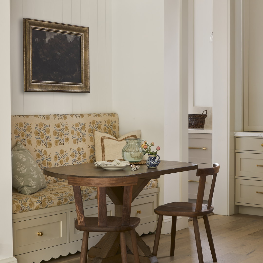 a table and chairs in a small room