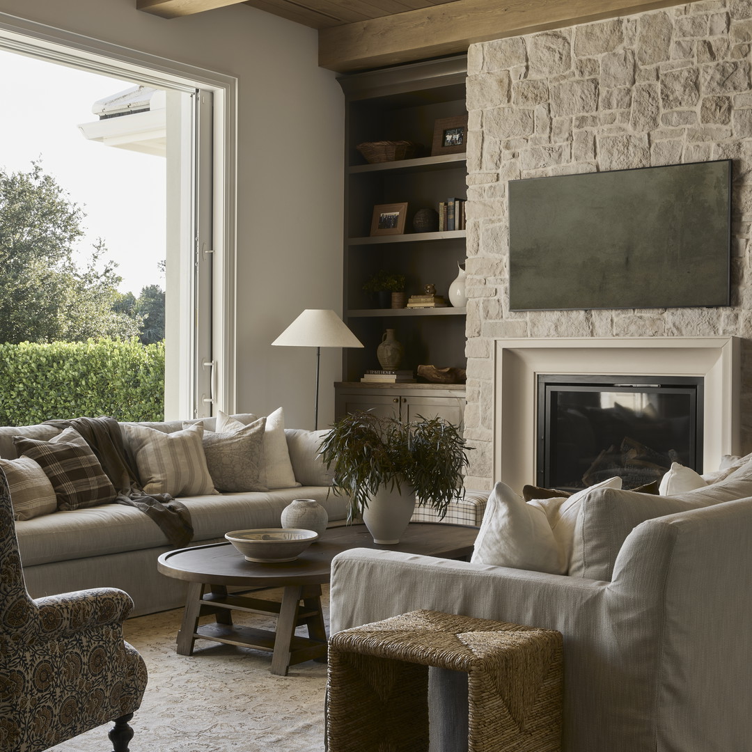 a living room filled with furniture and a fire place