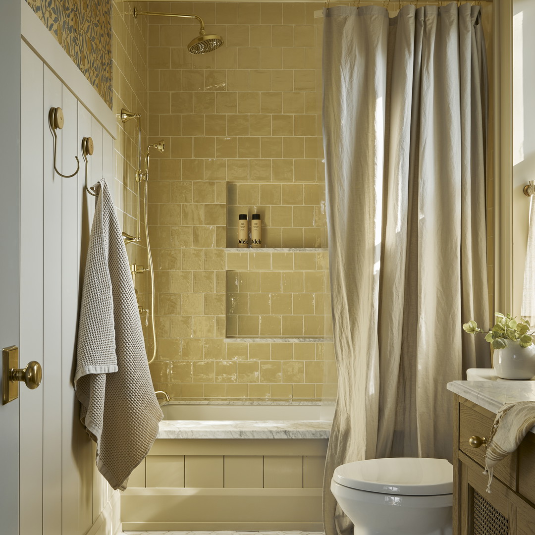 a bath room with a toilet a sink and a bath tub