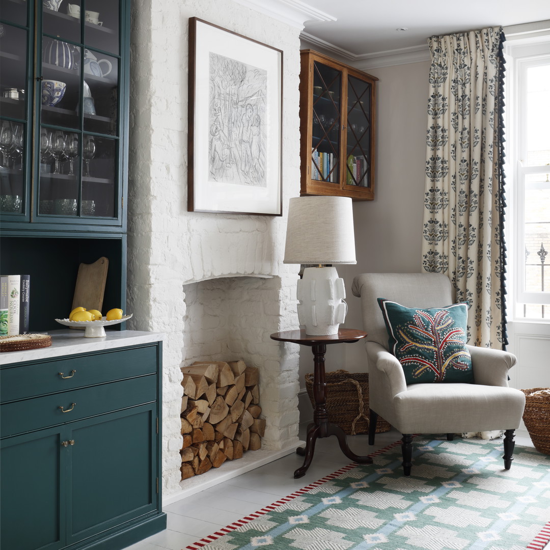 a living room filled with furniture and a fire place