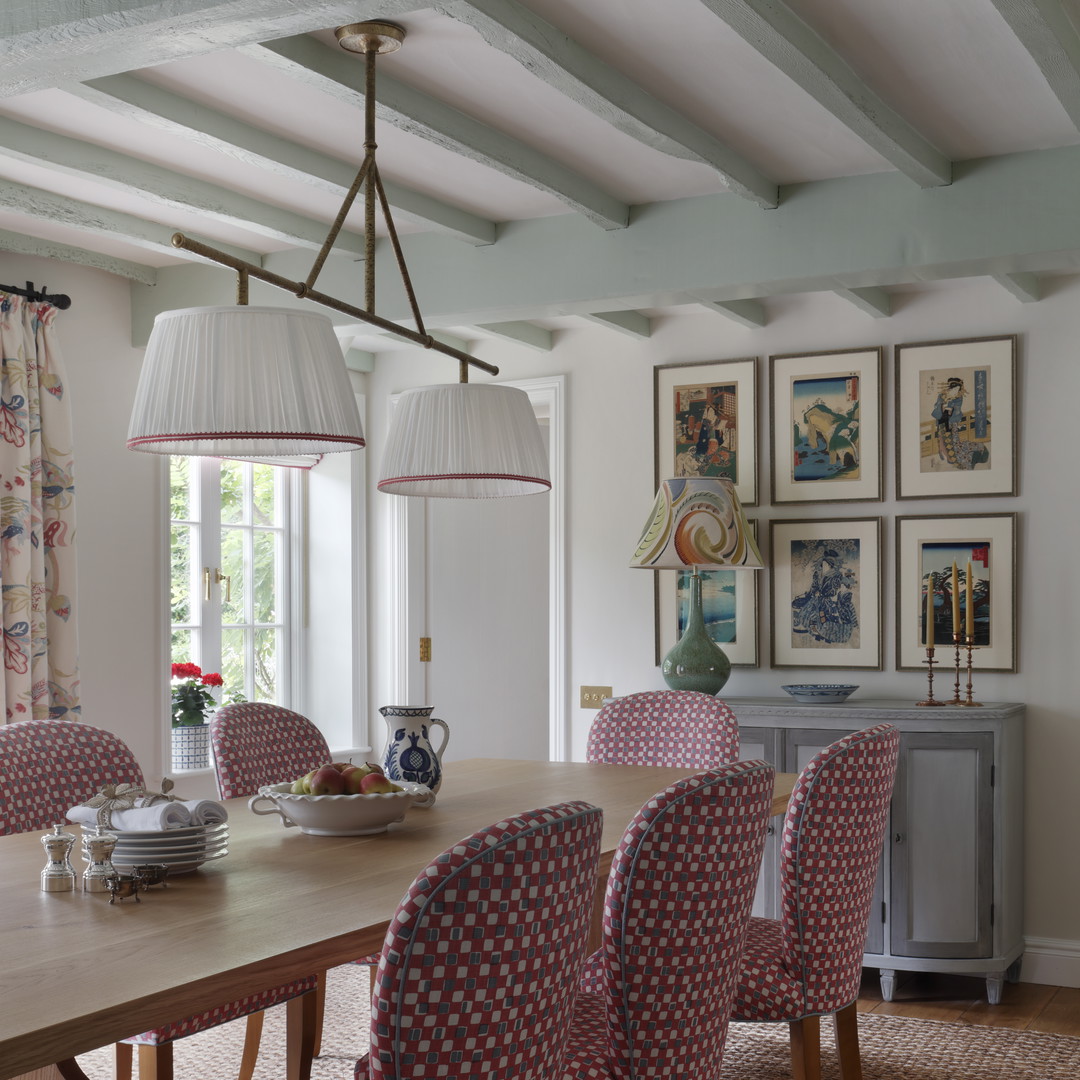 a dining room table with a bunch of chairs around it