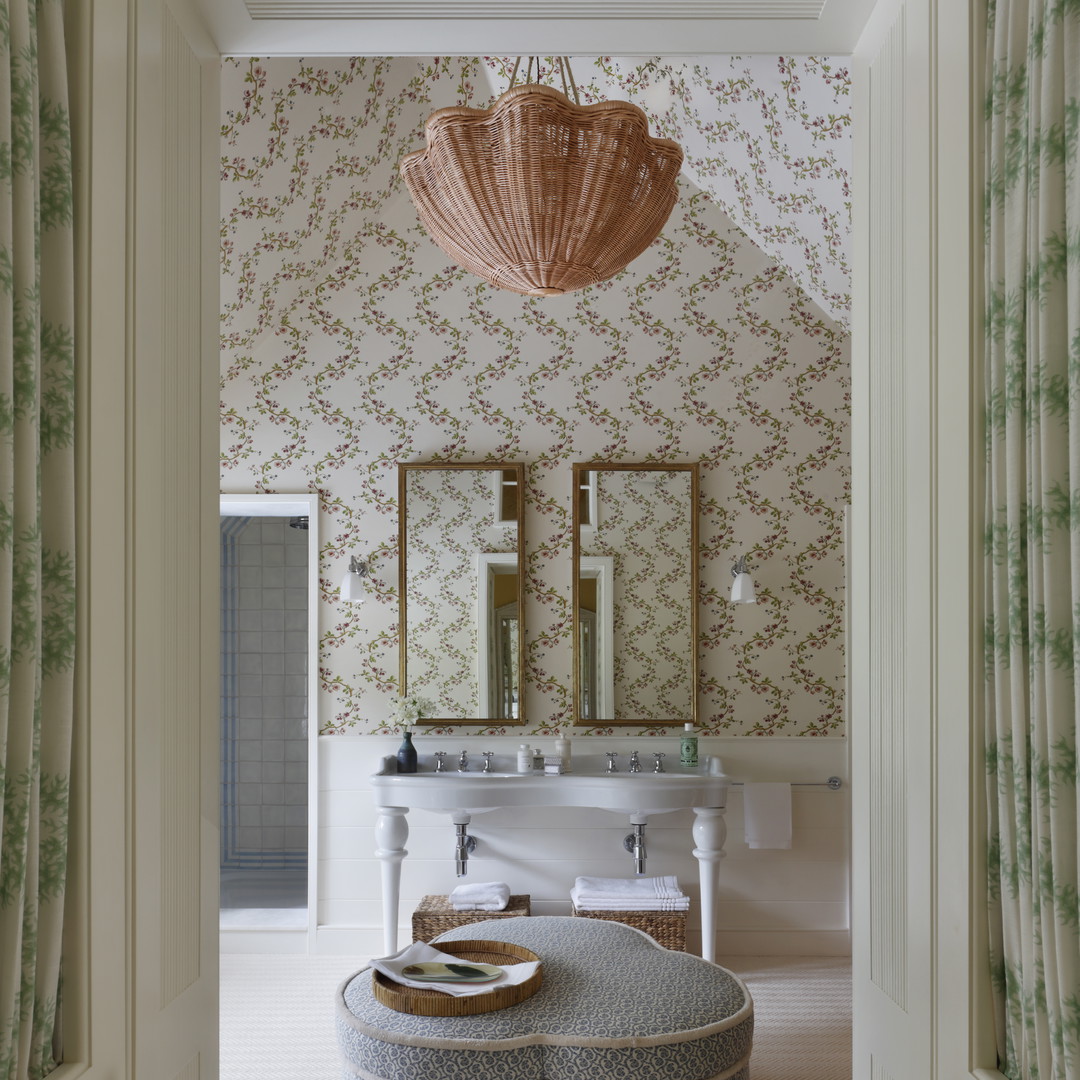 a bathroom with two sinks and a large ottoman