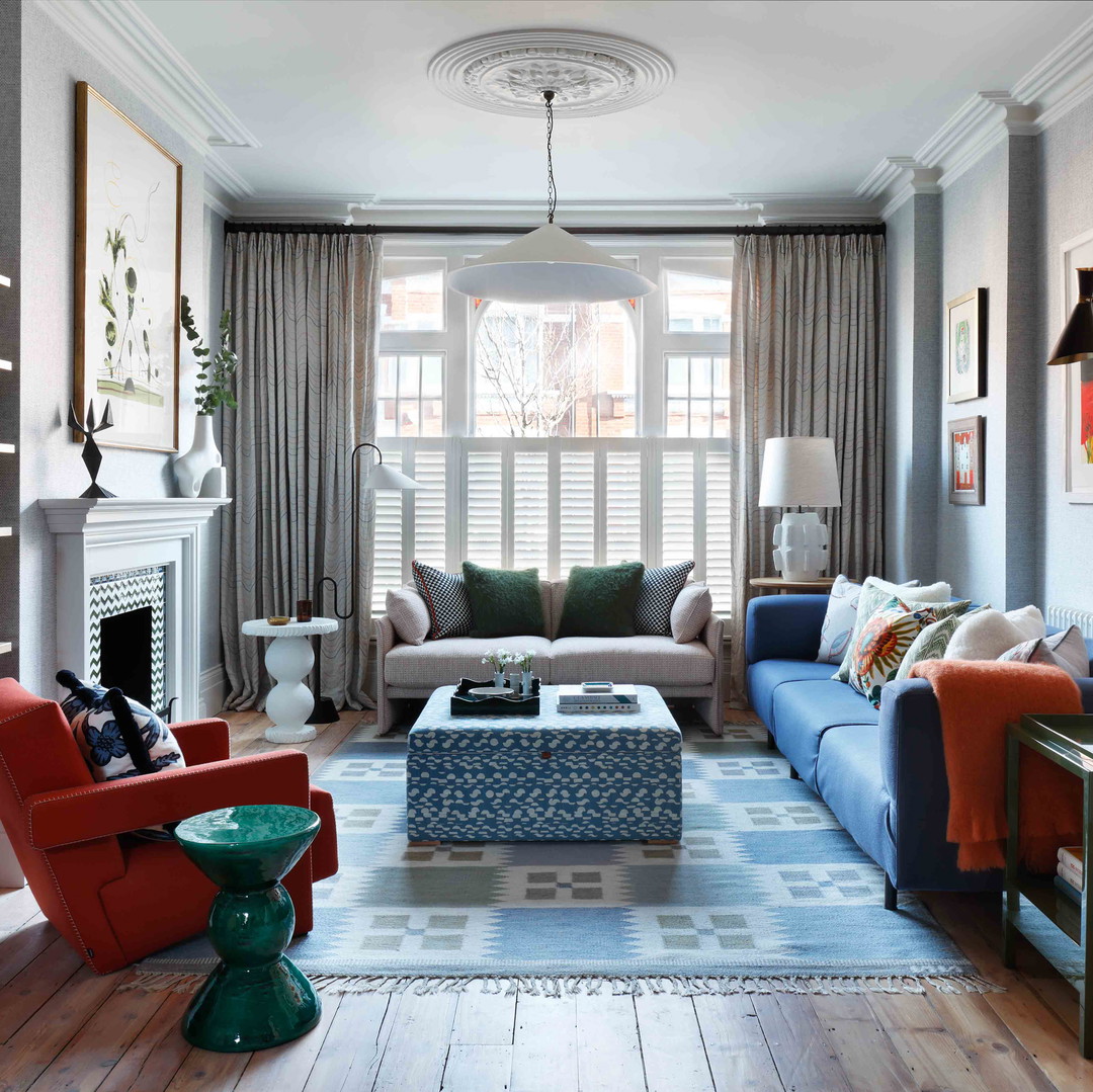 a living room filled with furniture and a fire place