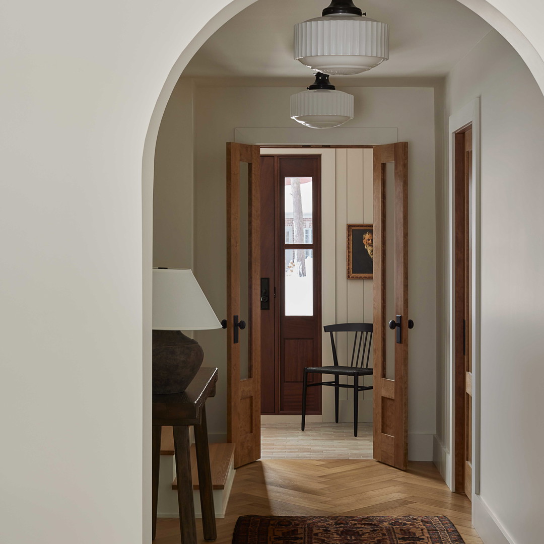 an archway leading to a living room and dining room