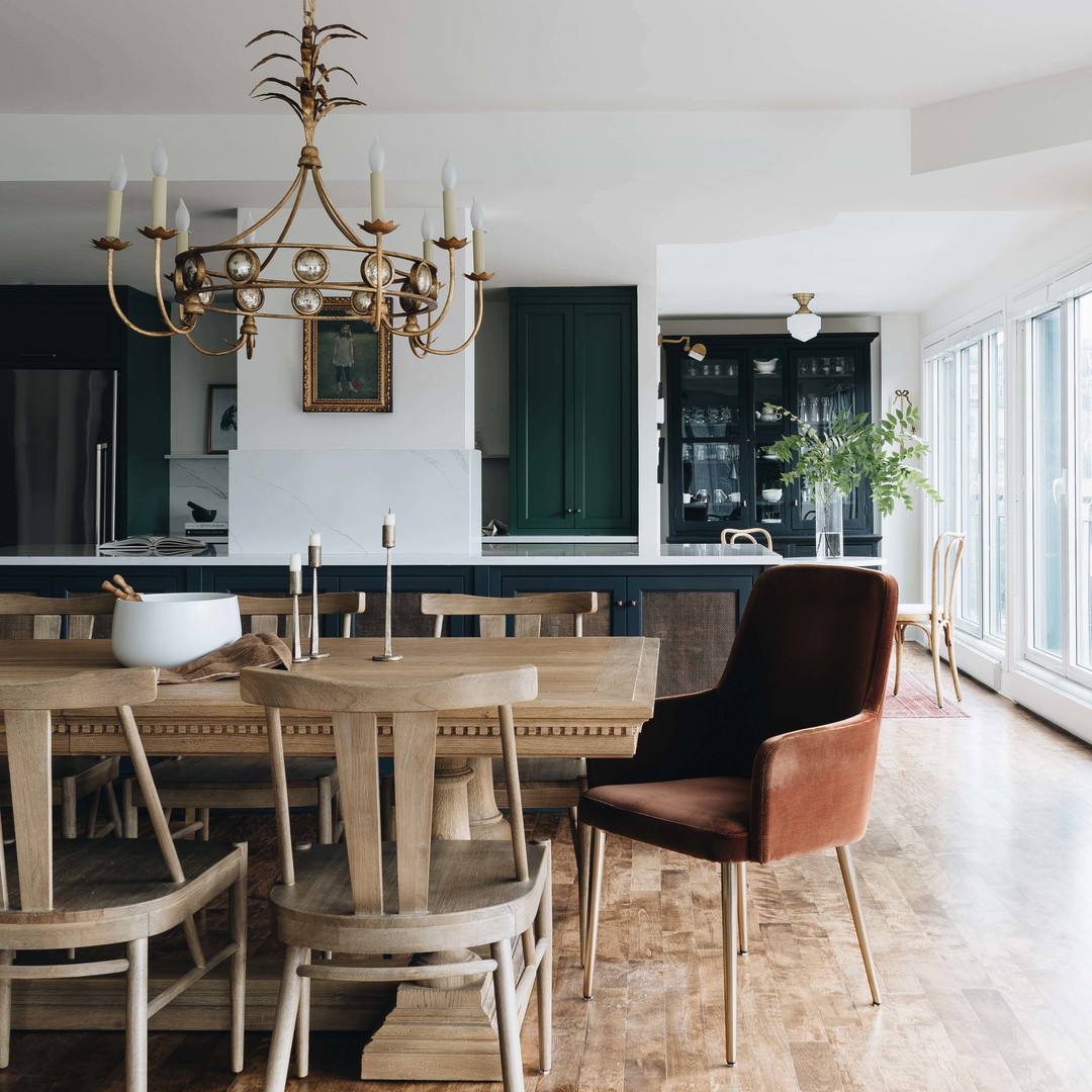 a dining room table with chairs and a chandelier