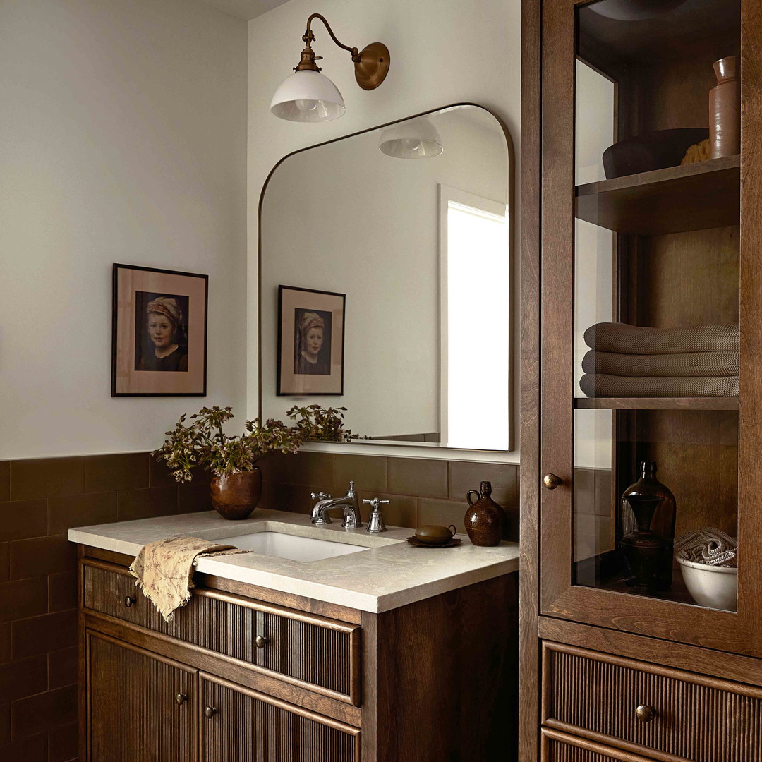 a bathroom with a large mirror and a sink