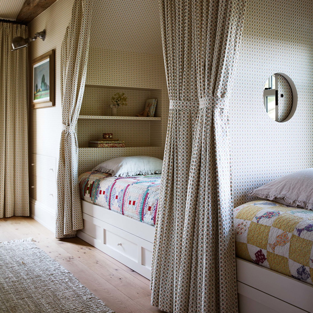 a bedroom with a canopy bed and curtains