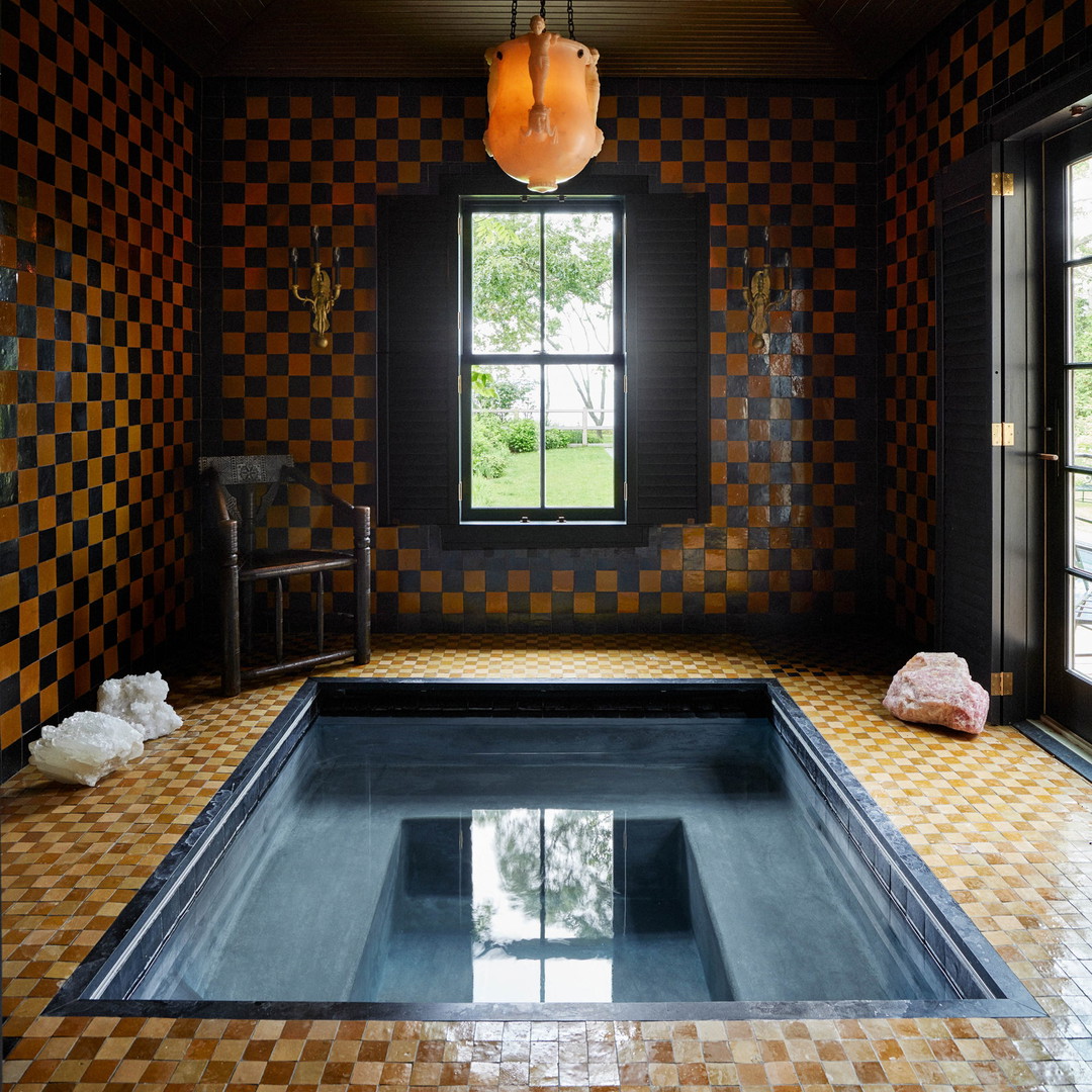 a large indoor swimming pool with a tiled floor