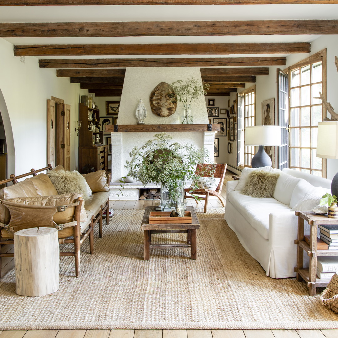 a living room filled with furniture and a fire place