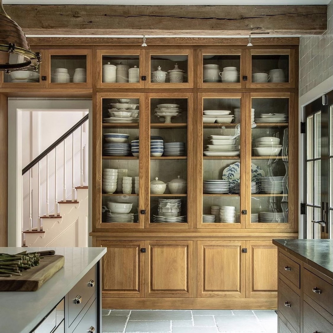 a kitchen filled with lots of wooden cabinets