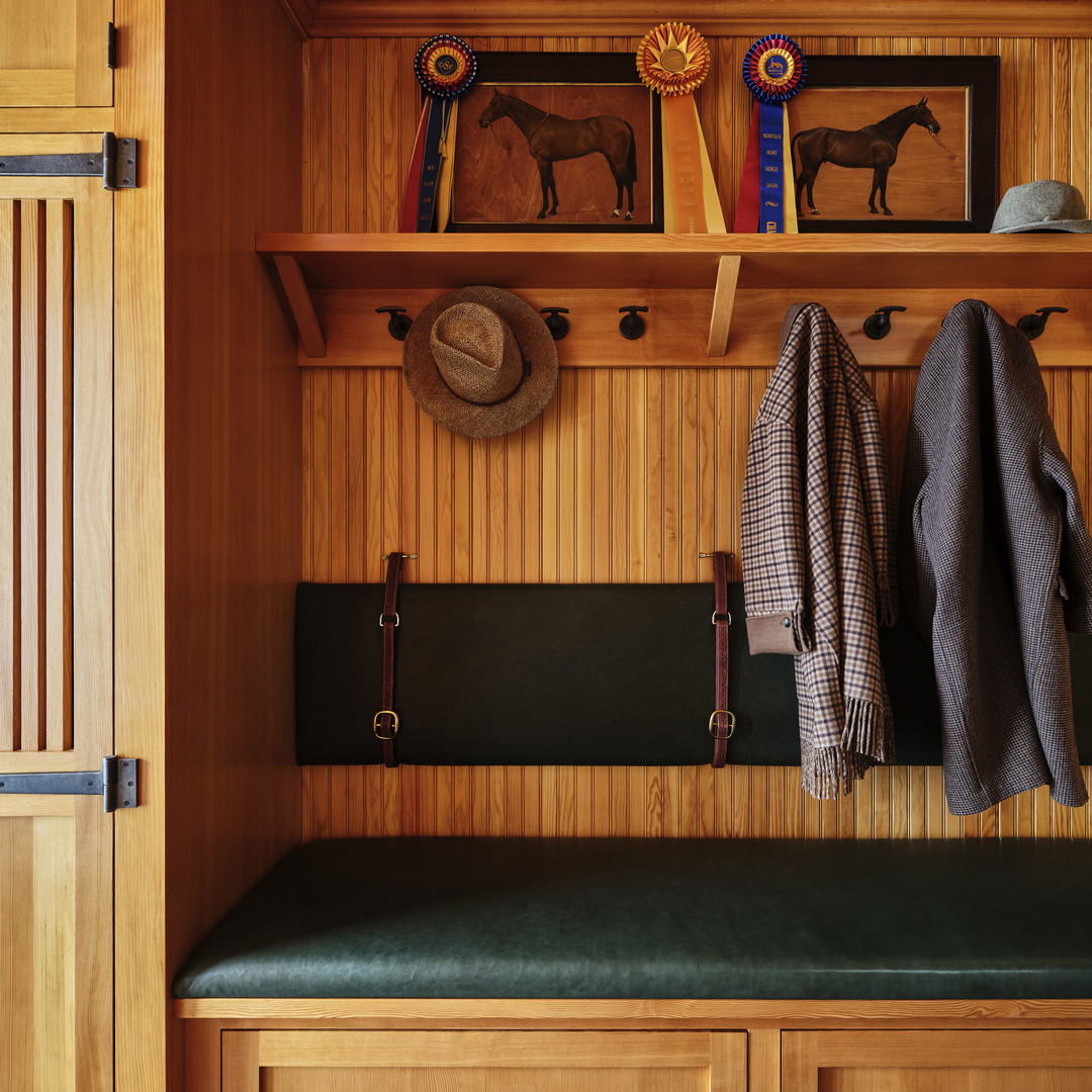 a bench and coat rack in a wooden room