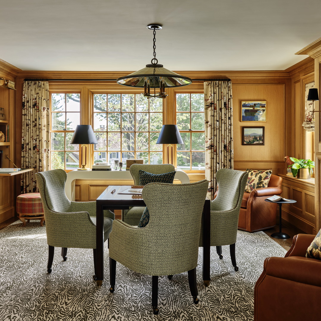 a dining room with a table and chairs