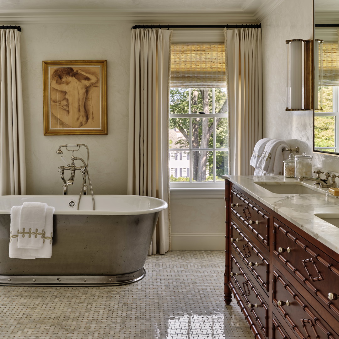 a bathroom with a tub and a sink