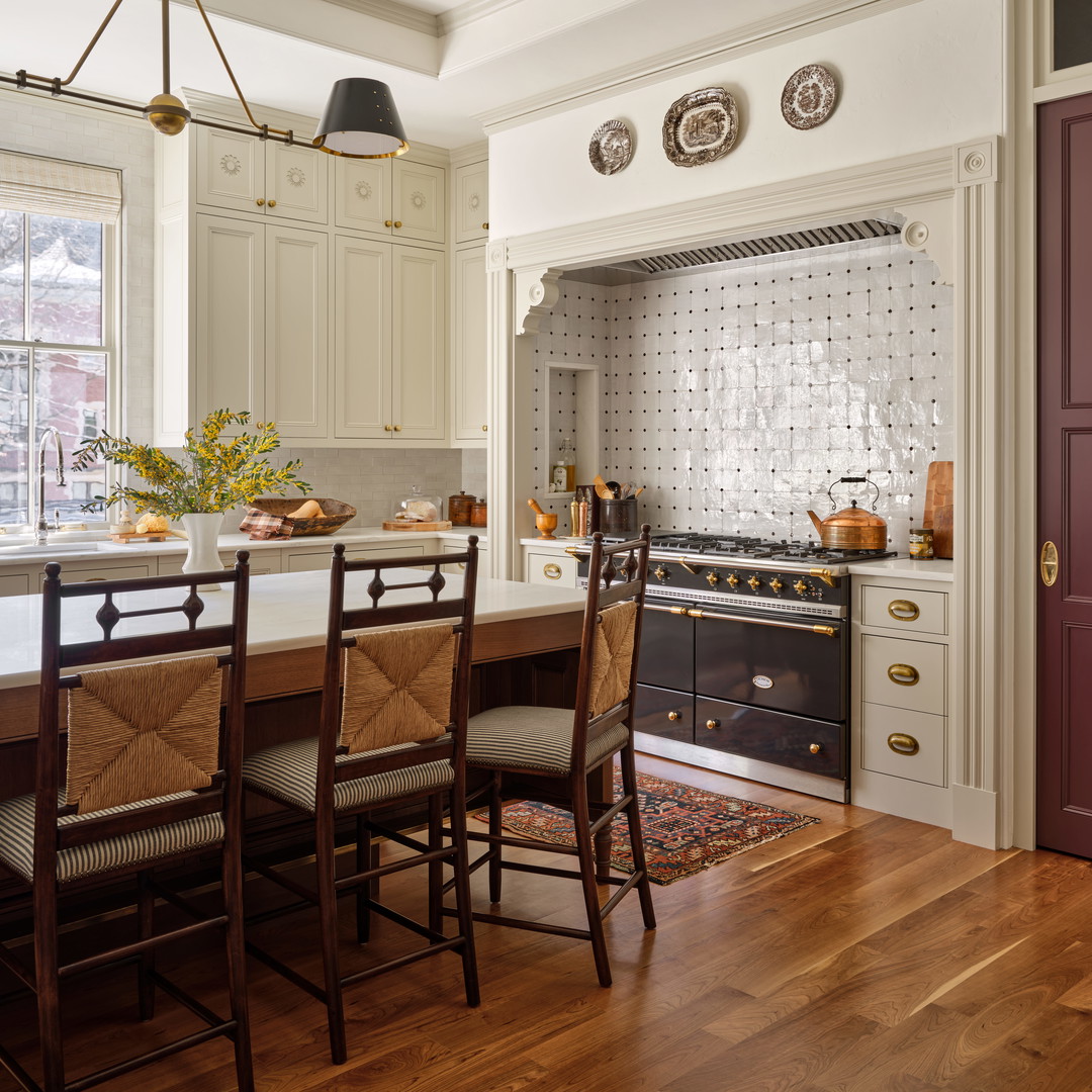 a kitchen with a table and chairs in it