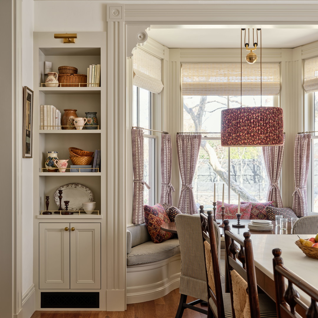 a dining room with a table and chairs