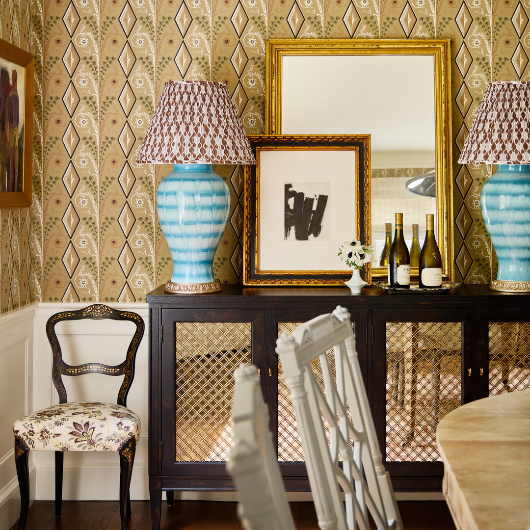 a dining room with a table and chairs