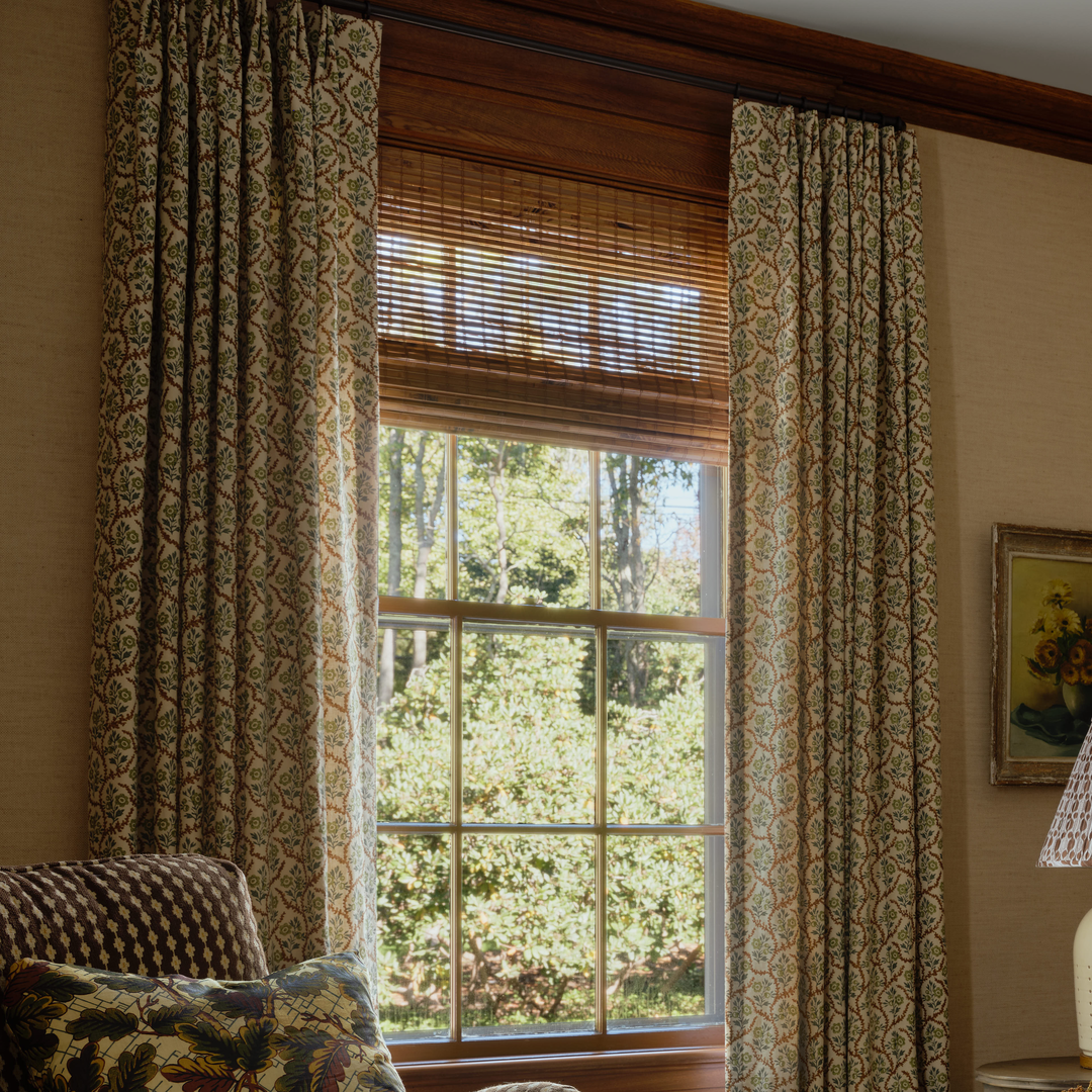 a living room filled with furniture and a window