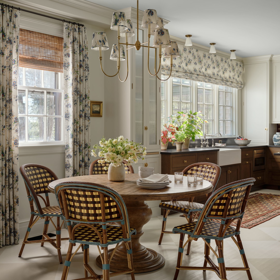 a dining room with a table and chairs