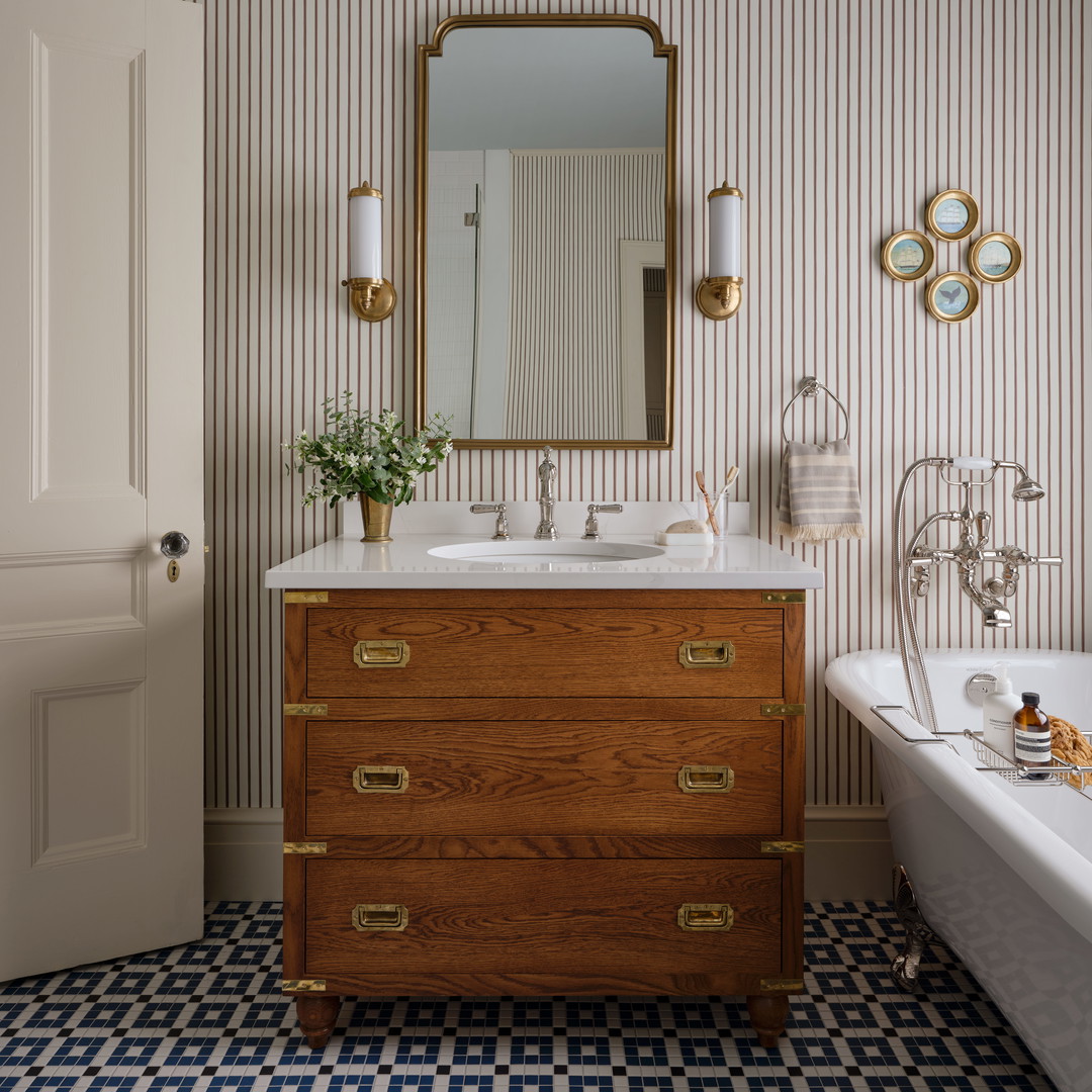 a bathroom with a sink, mirror and bathtub