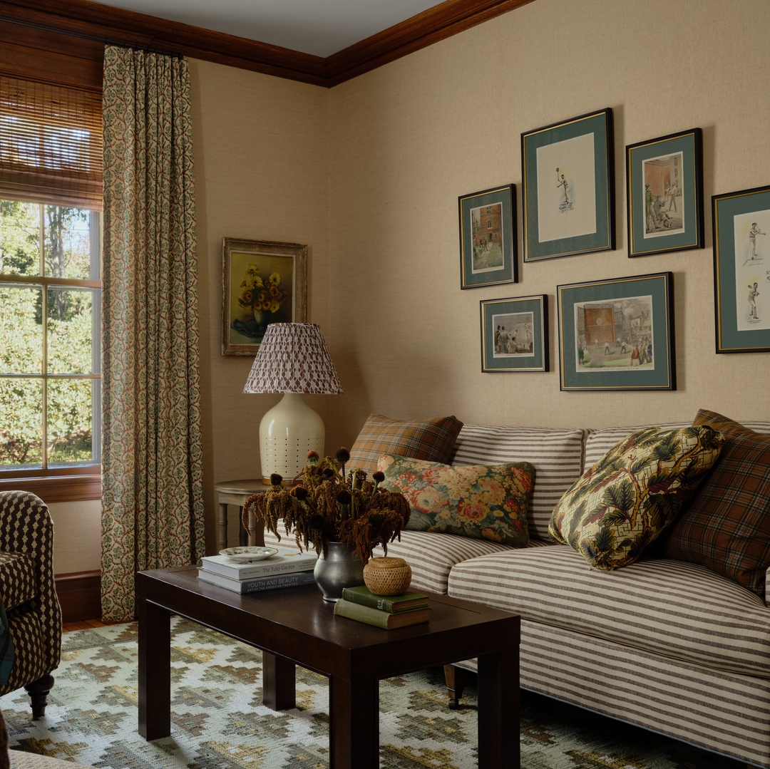 a living room filled with furniture and a window