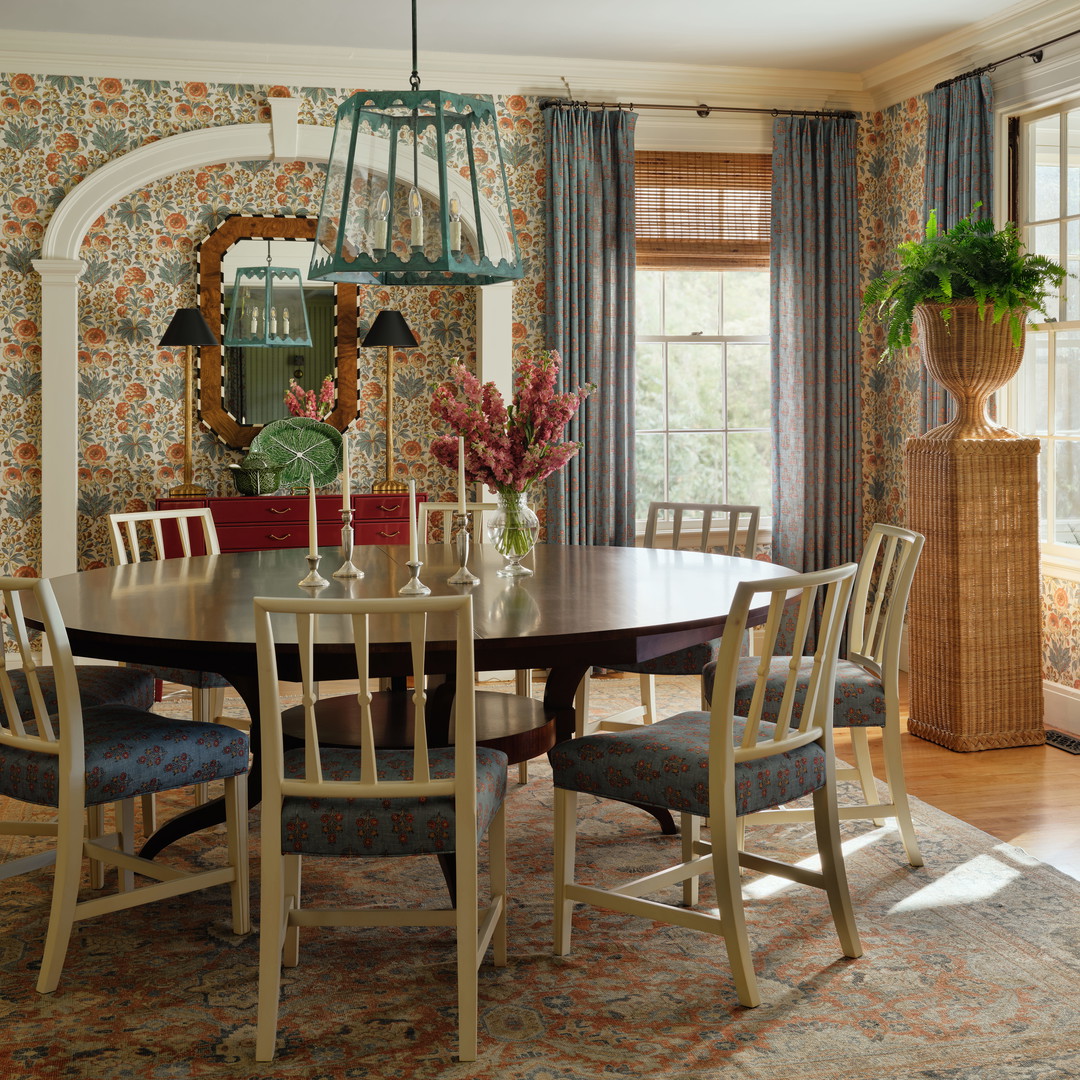 a dining room with a table and chairs