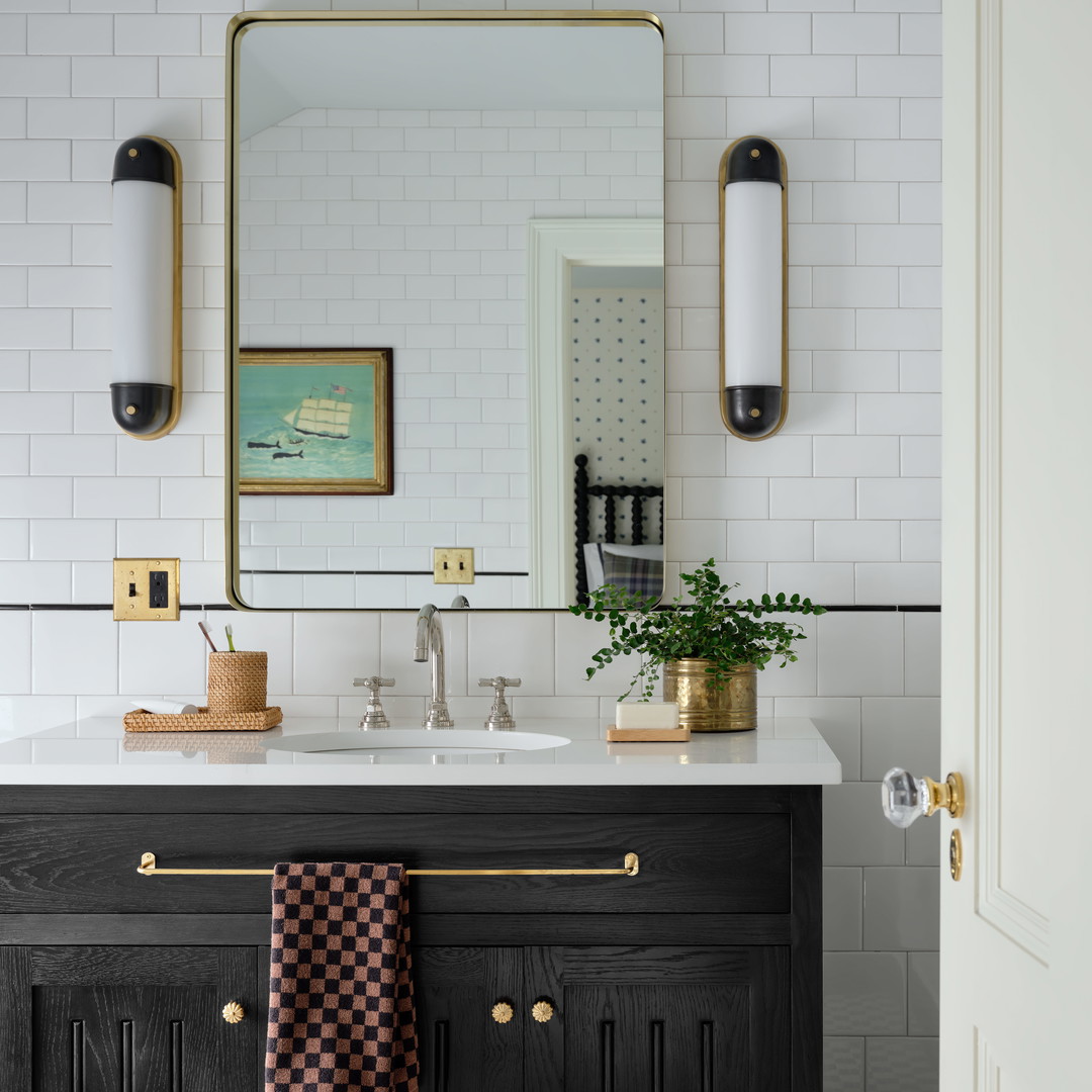 a bathroom with a black and white checkered floor