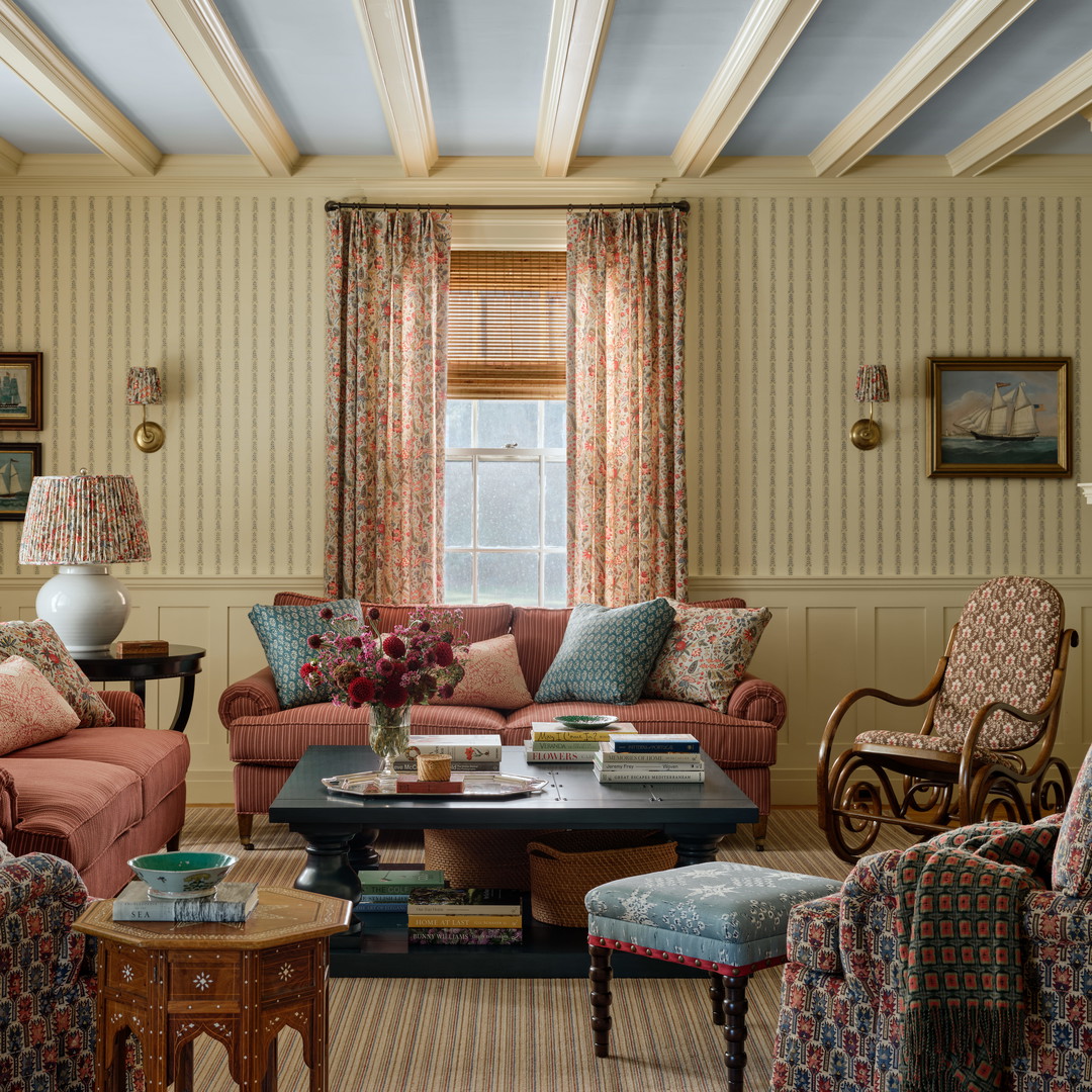 a living room filled with furniture and a fire place