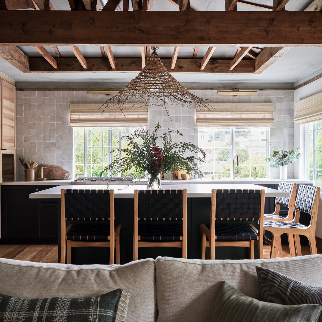 a living room with a couch a table and chairs