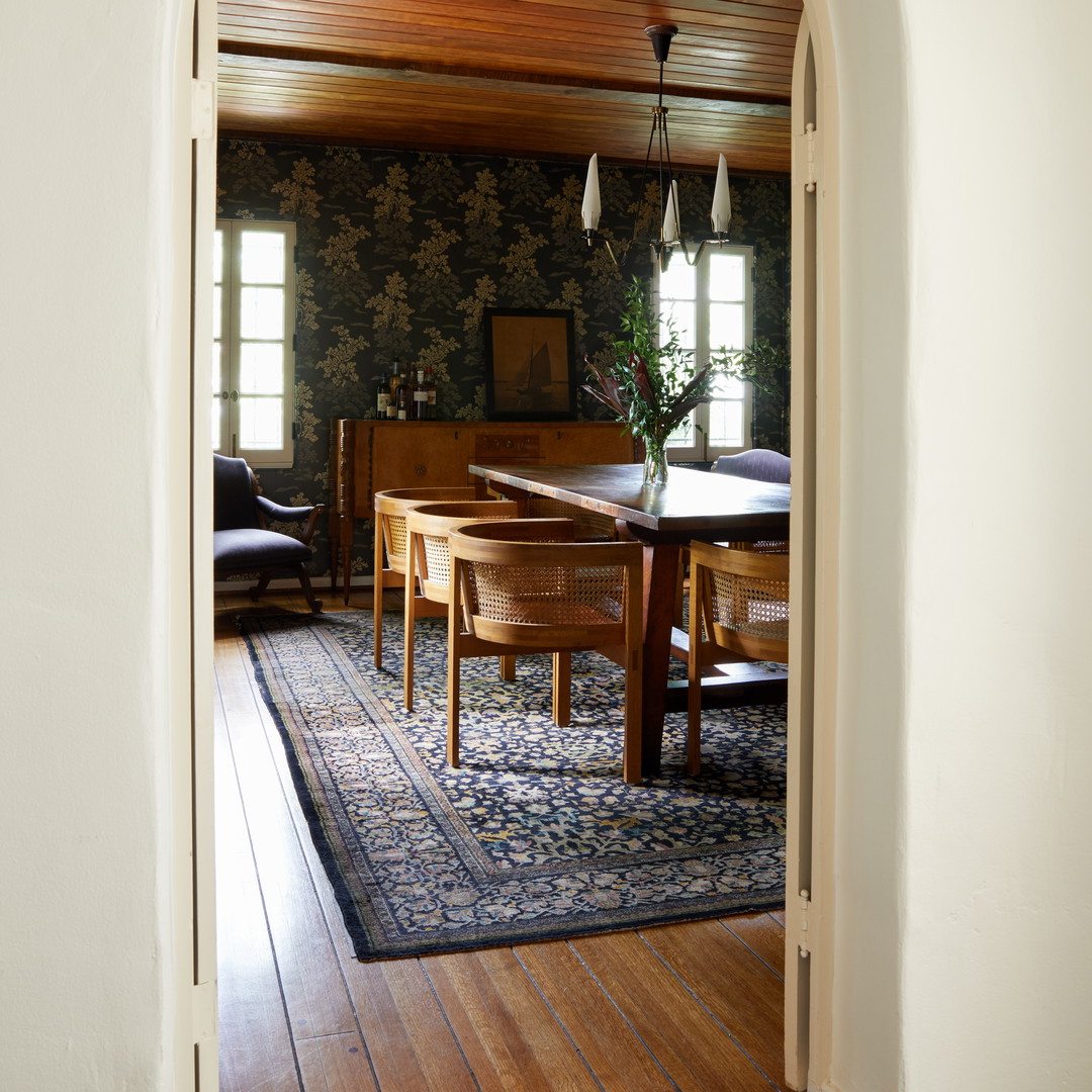 a dining room with a table and chairs