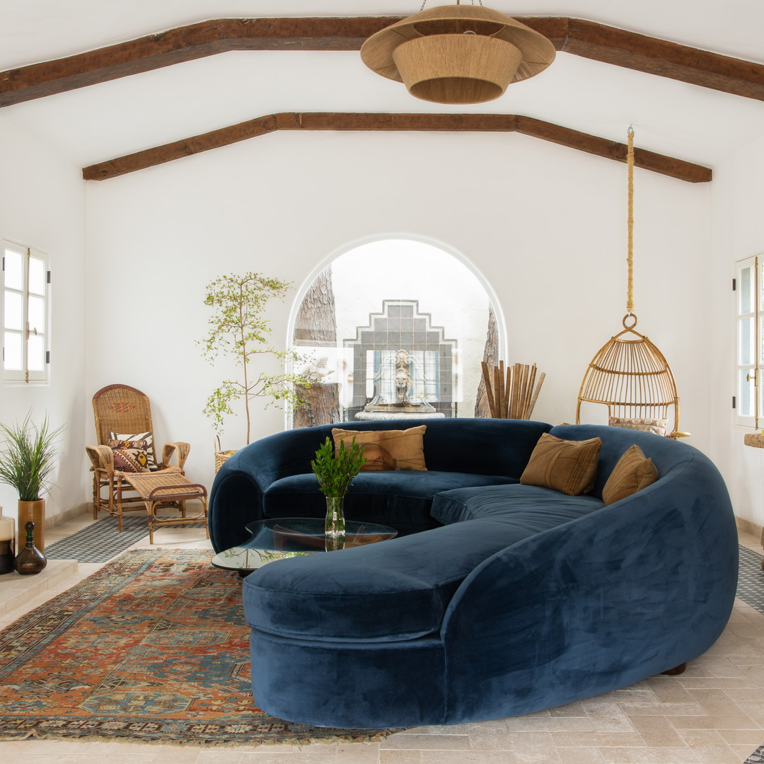 a living room filled with furniture and a fire place