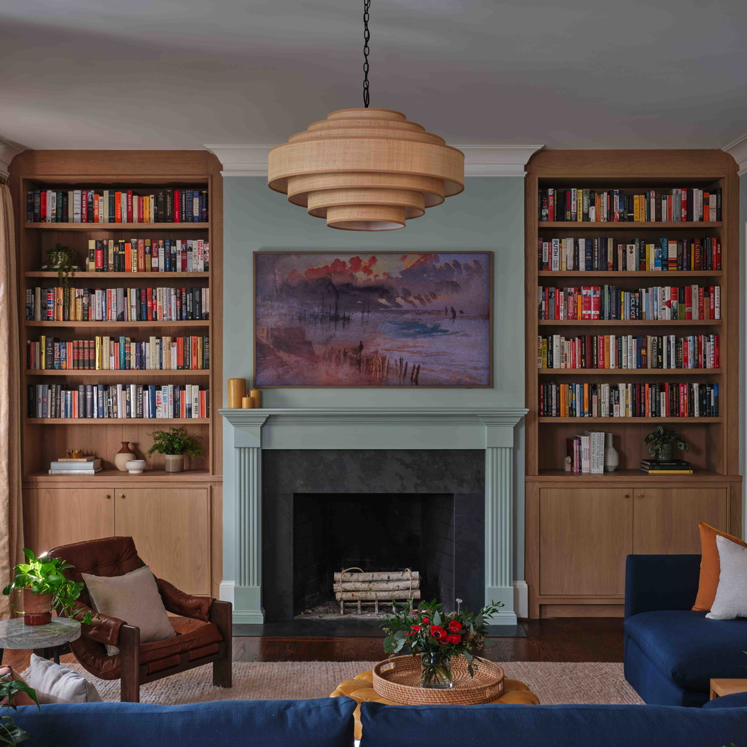 a living room filled with furniture and a fire place