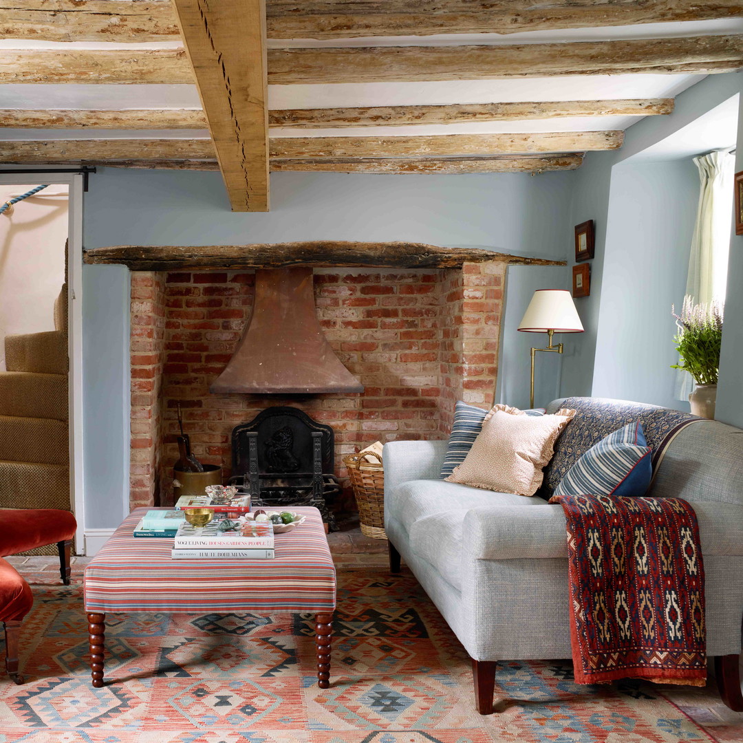 a living room filled with furniture and a fire place