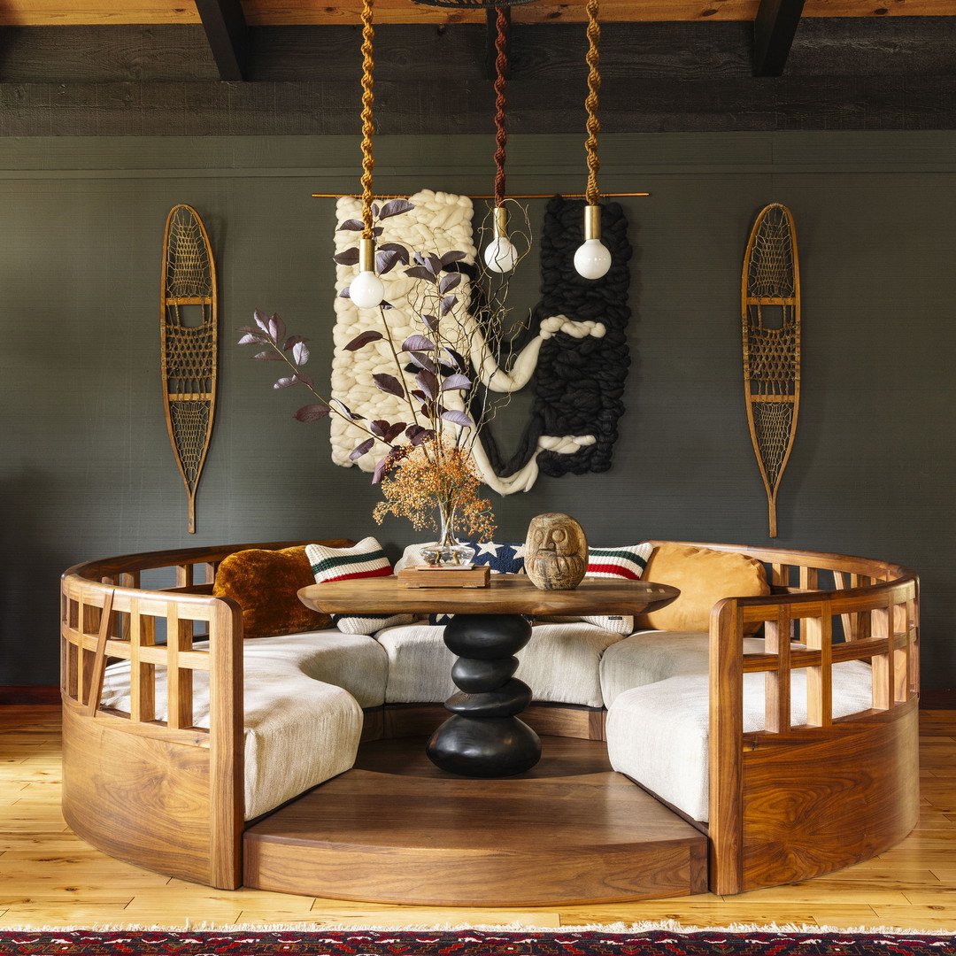 a living room filled with furniture and a chandelier