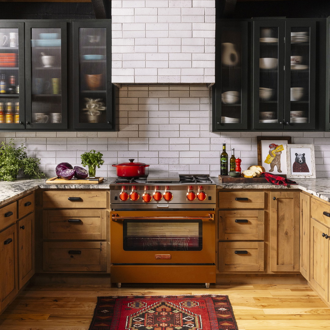 a kitchen with wooden cabinets and a rug on the floor