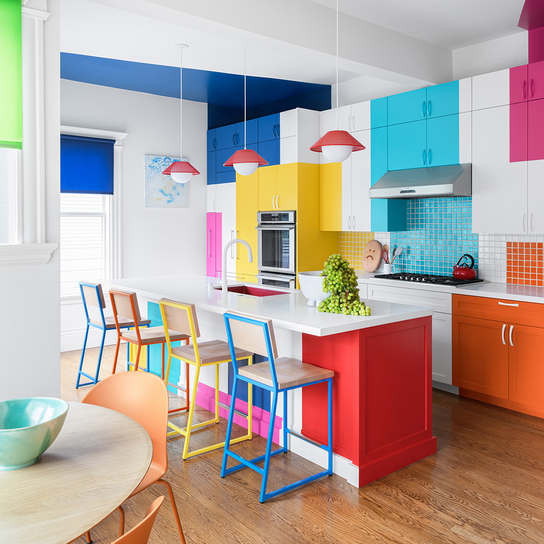 a brightly colored kitchen with a table and chairs