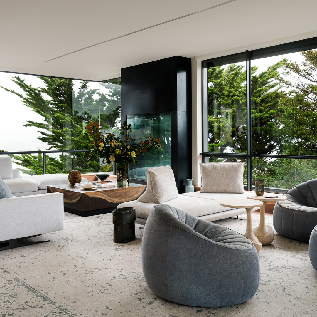 a living room filled with furniture and a large window