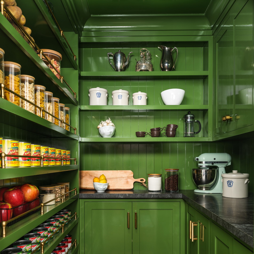 a green pantry filled with lots of food