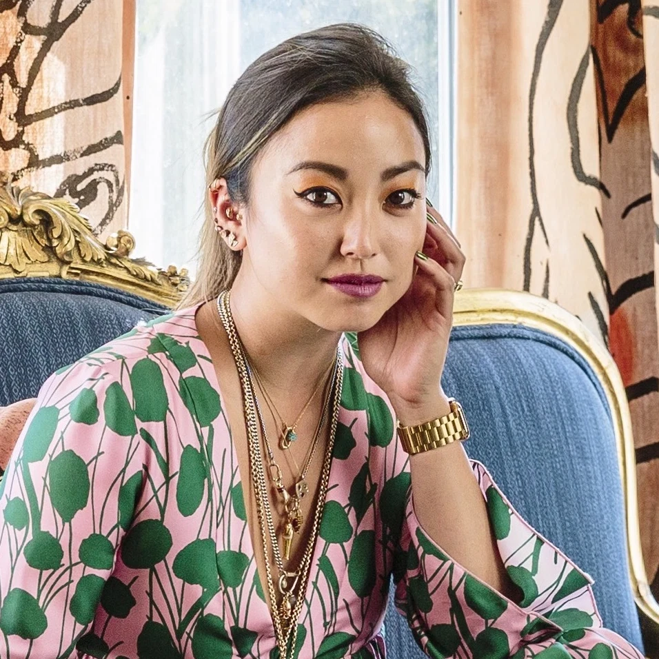 a woman sitting on top of a blue couch