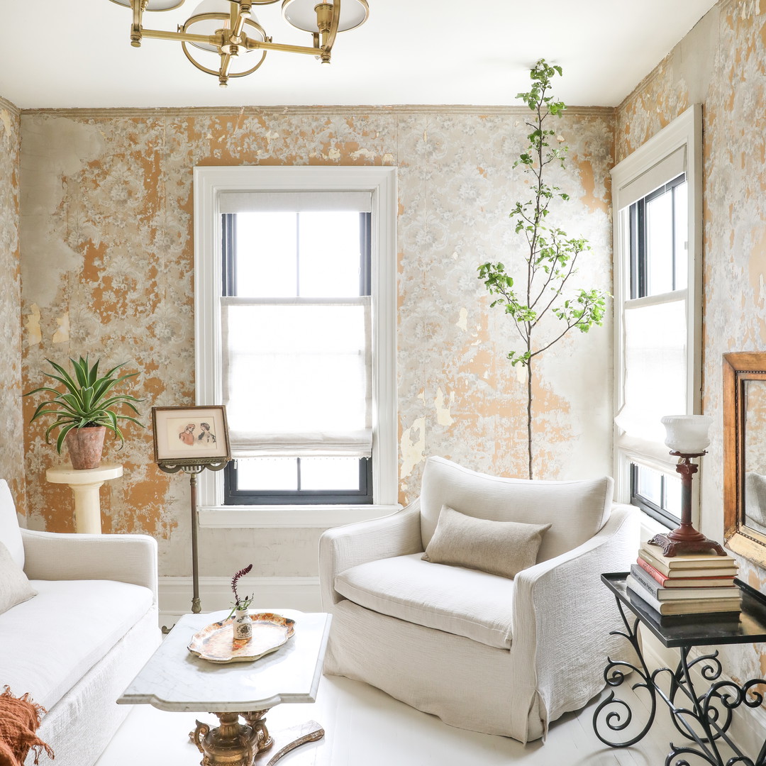 a living room filled with furniture and a window