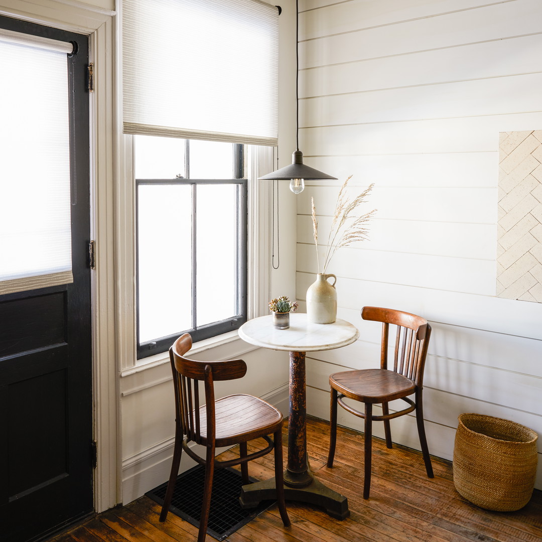 two chairs and a table in a room