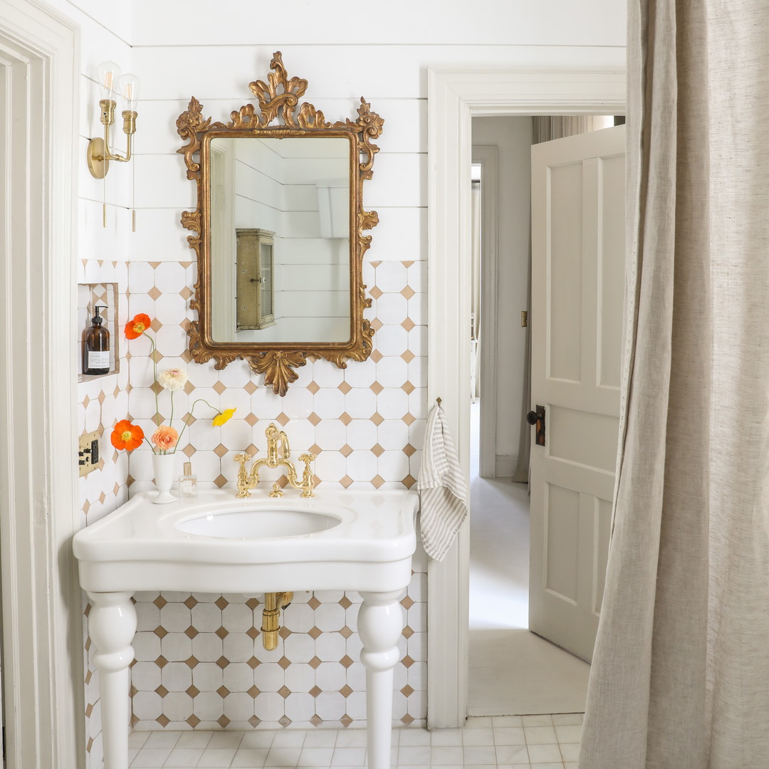 a bathroom with a sink and a mirror