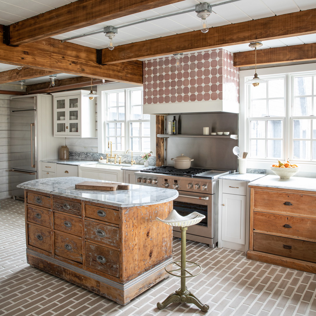 a kitchen with an island in the middle of the room