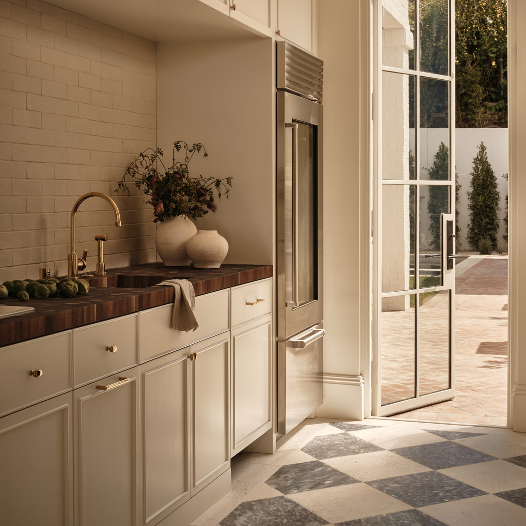 a kitchen with a checkered floor and a large window