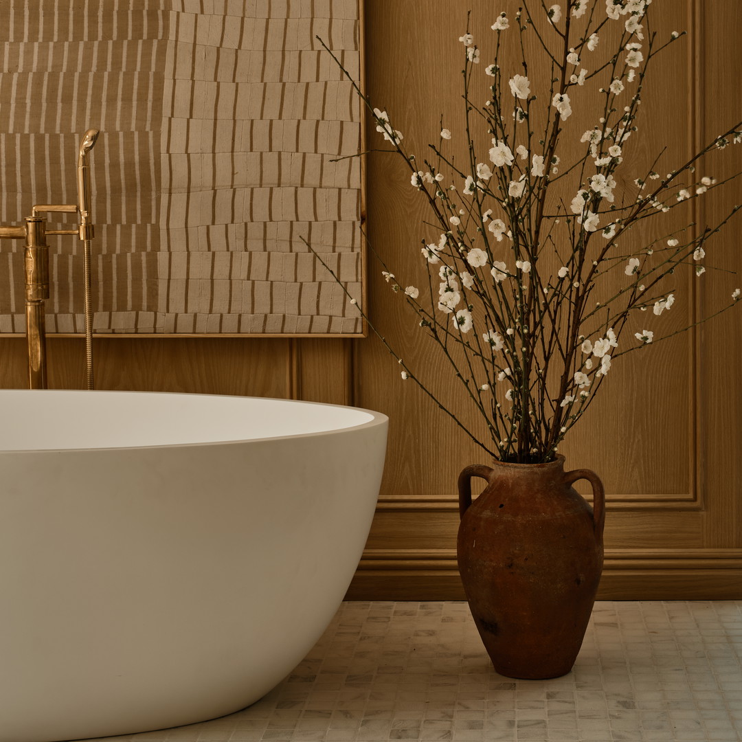 a white bath tub sitting next to a white sink